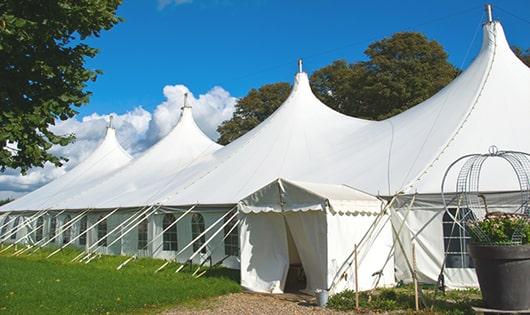 a row of portable restrooms placed outdoors for attendees of a special event in Crystal